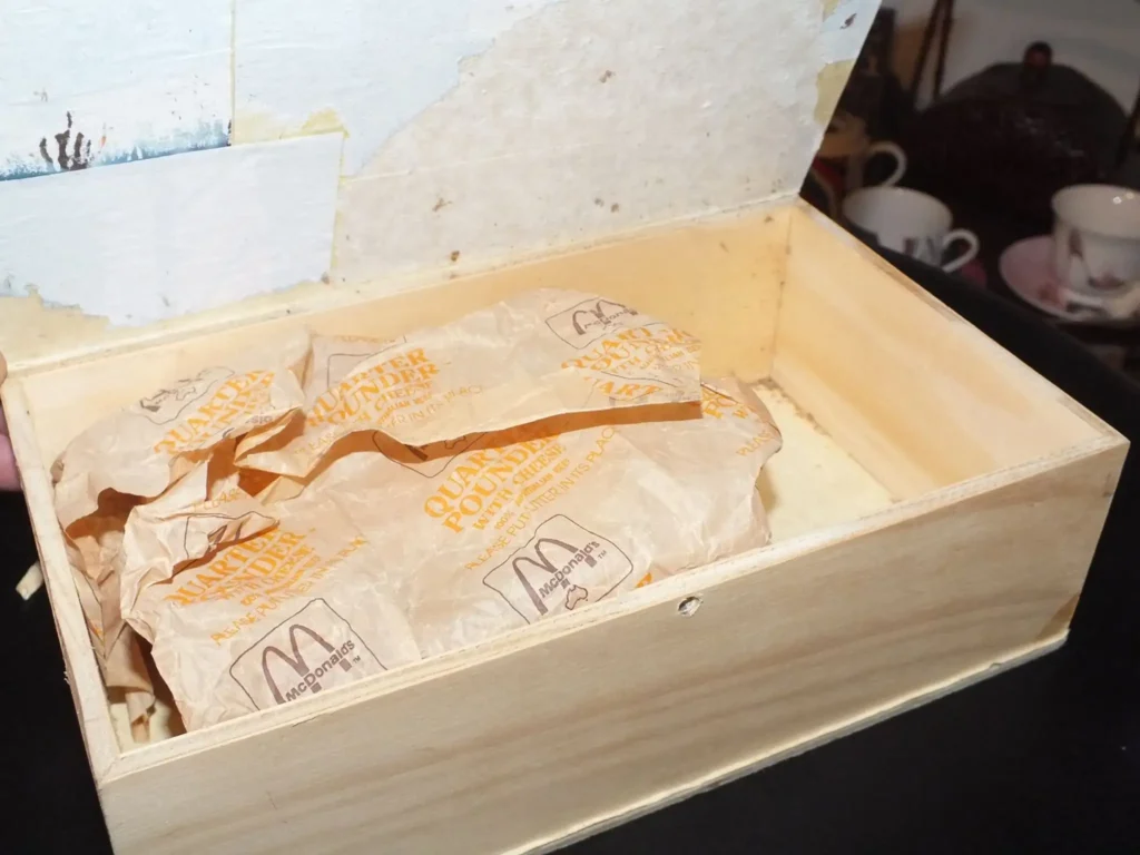 quarter pounder in cardboard and timber box